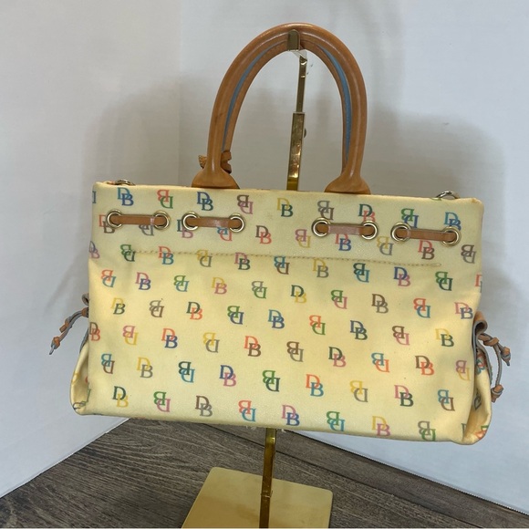 Dooney & Bourke Cream Satchel Bag pre-owned. Strap has stain. - Picture 6 of 16